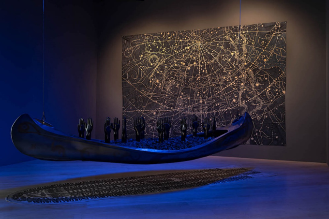 Photo of Betye Saar's Gliding into Midnight, with strong blue lighting